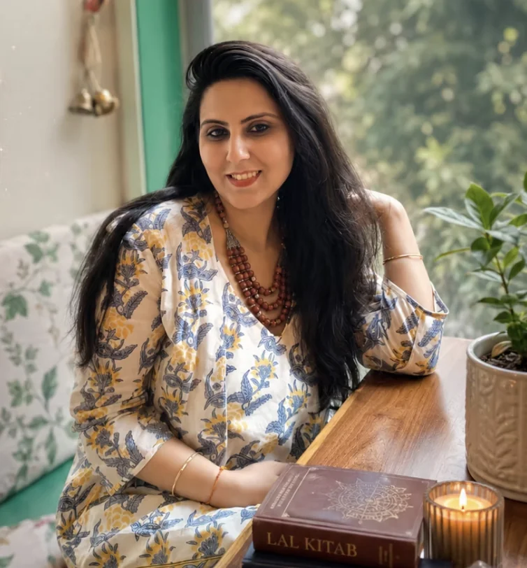 Ridhima Sehgal, astrologer and founder of Vedtaara, seated with the Lal Kitab text